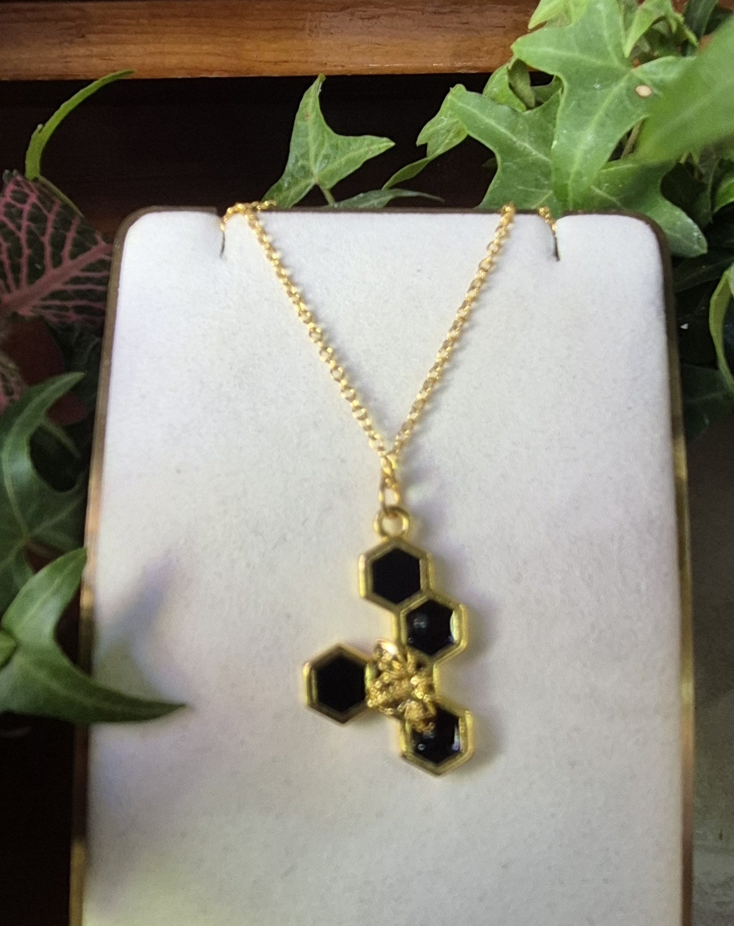 Black resin honeycomb and bee necklace (5 honeycomb long)