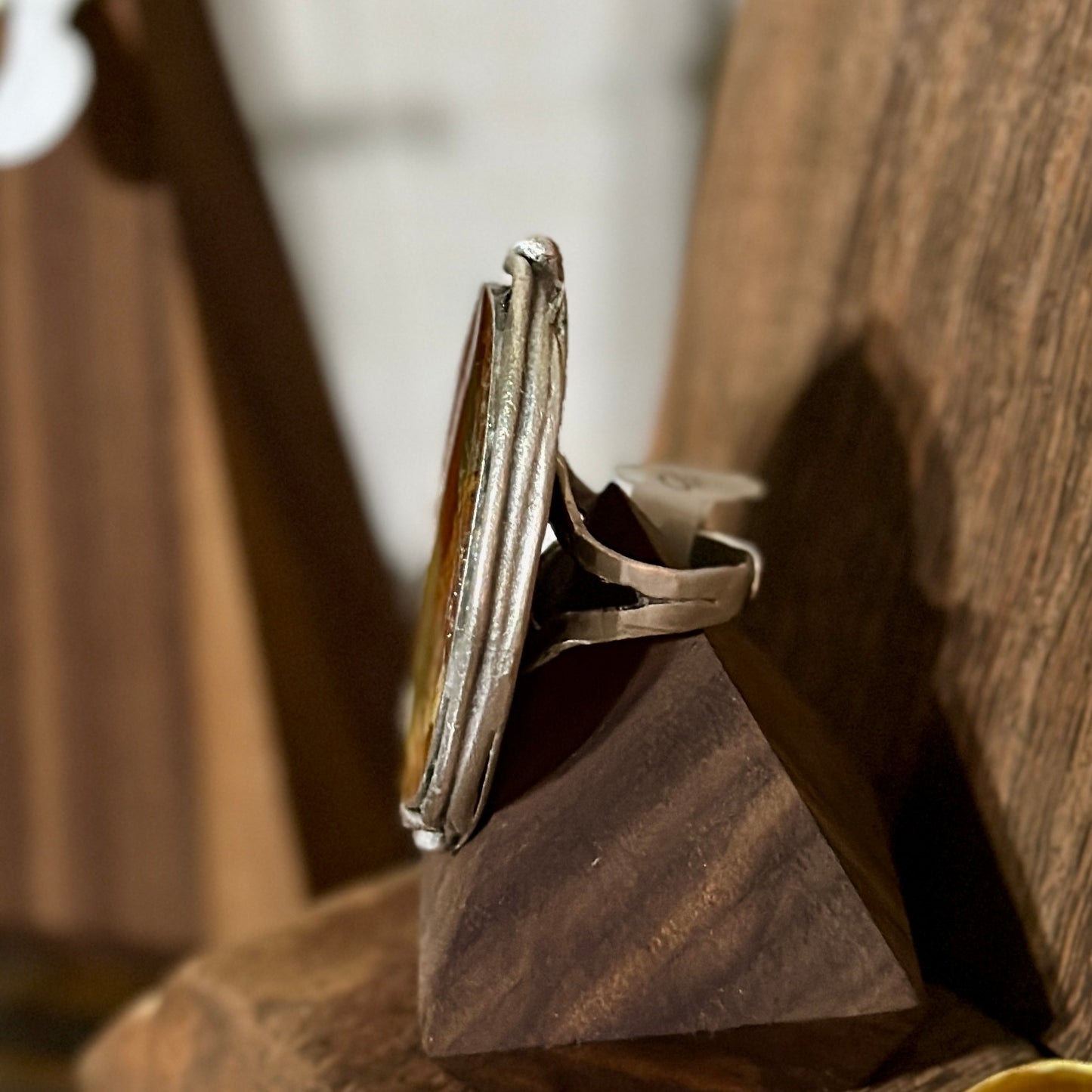 Autumn botanical ring in a large, silver oval setting
