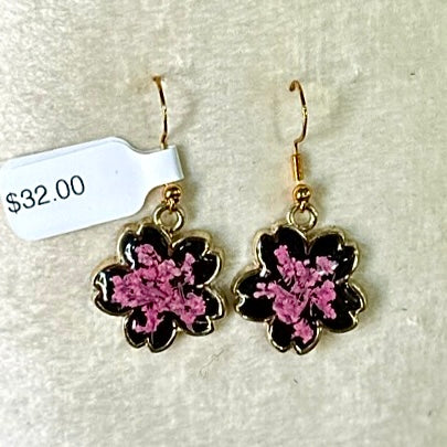 Gold-framed botanical earrings in pink and black