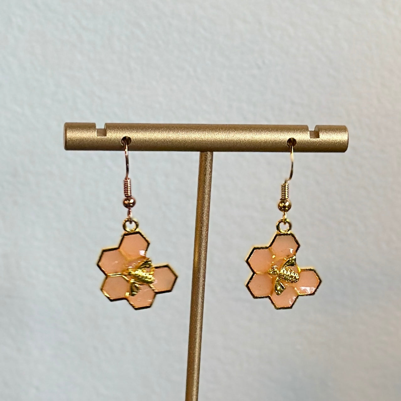 Peach honeycomb and bee earrings (6 hex)