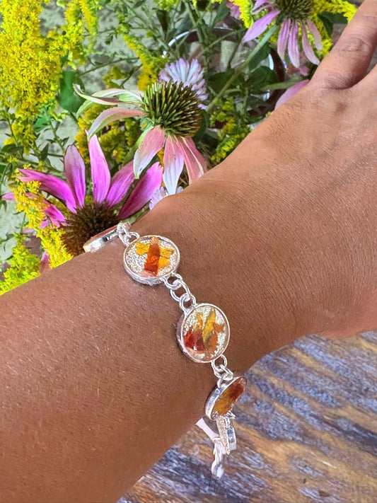 Autumn botanical bracelet with 7 baubles in silver setting (orange, red, and yellow)