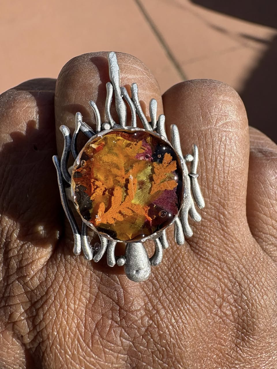 Autumn botanical ring in a wavy, silver setting