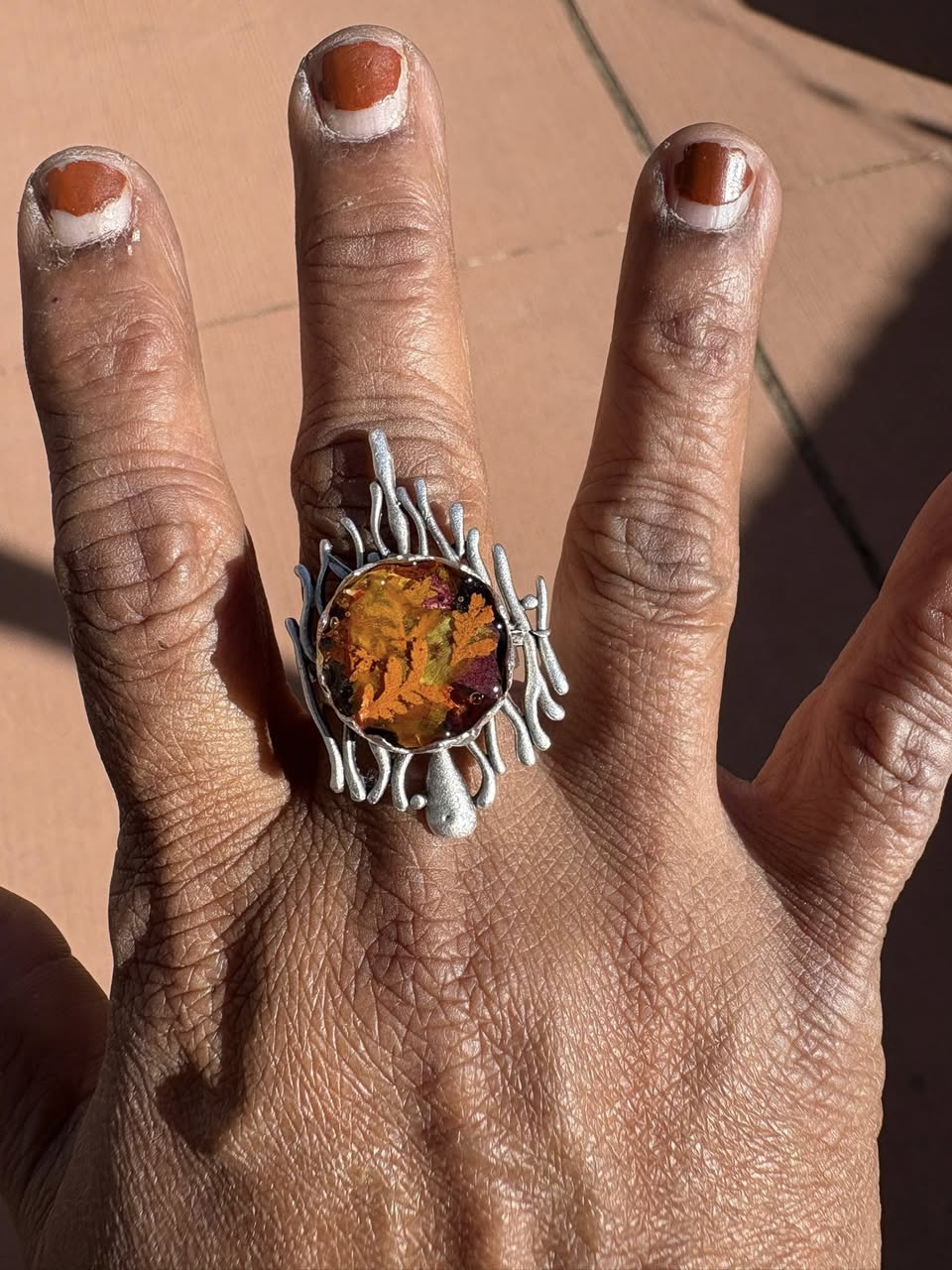 Autumn botanical ring in a wavy, silver setting