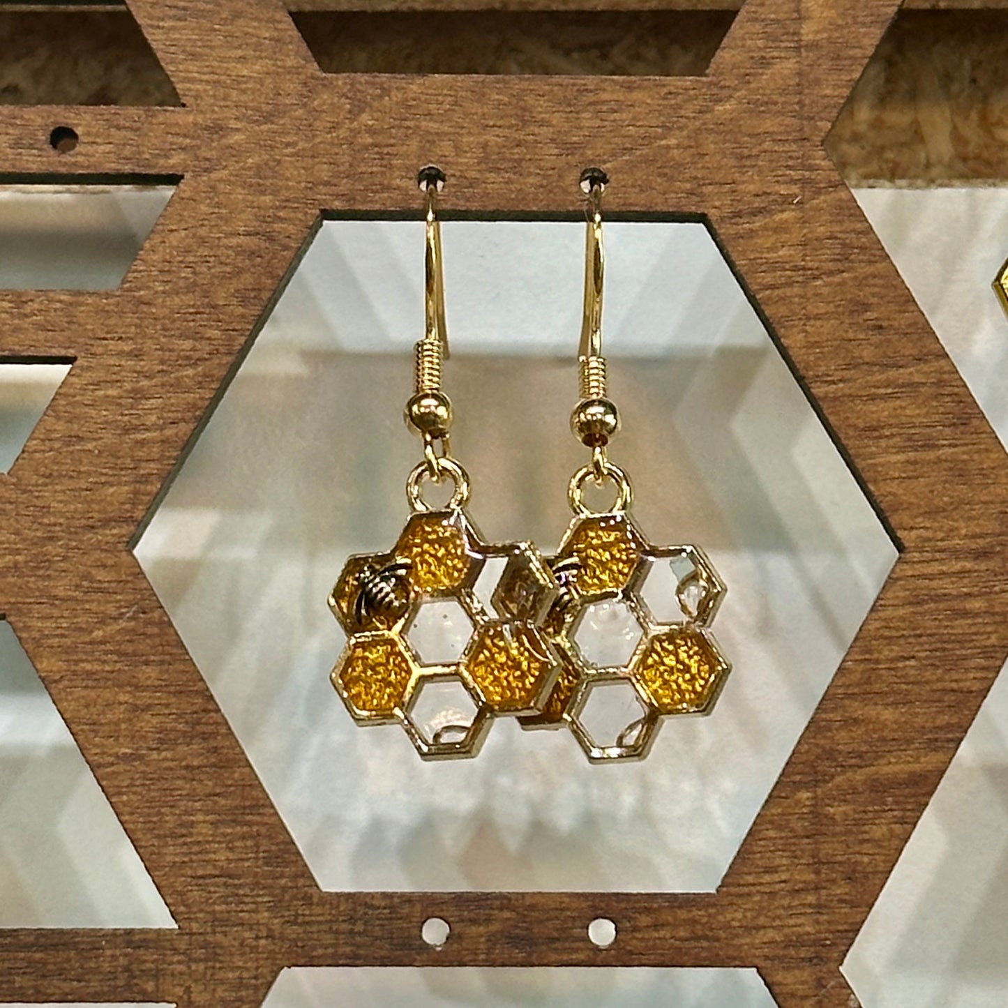Gold and clear honeycomb earrings with small bee (7 hex)