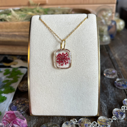Gold pendent pink flower