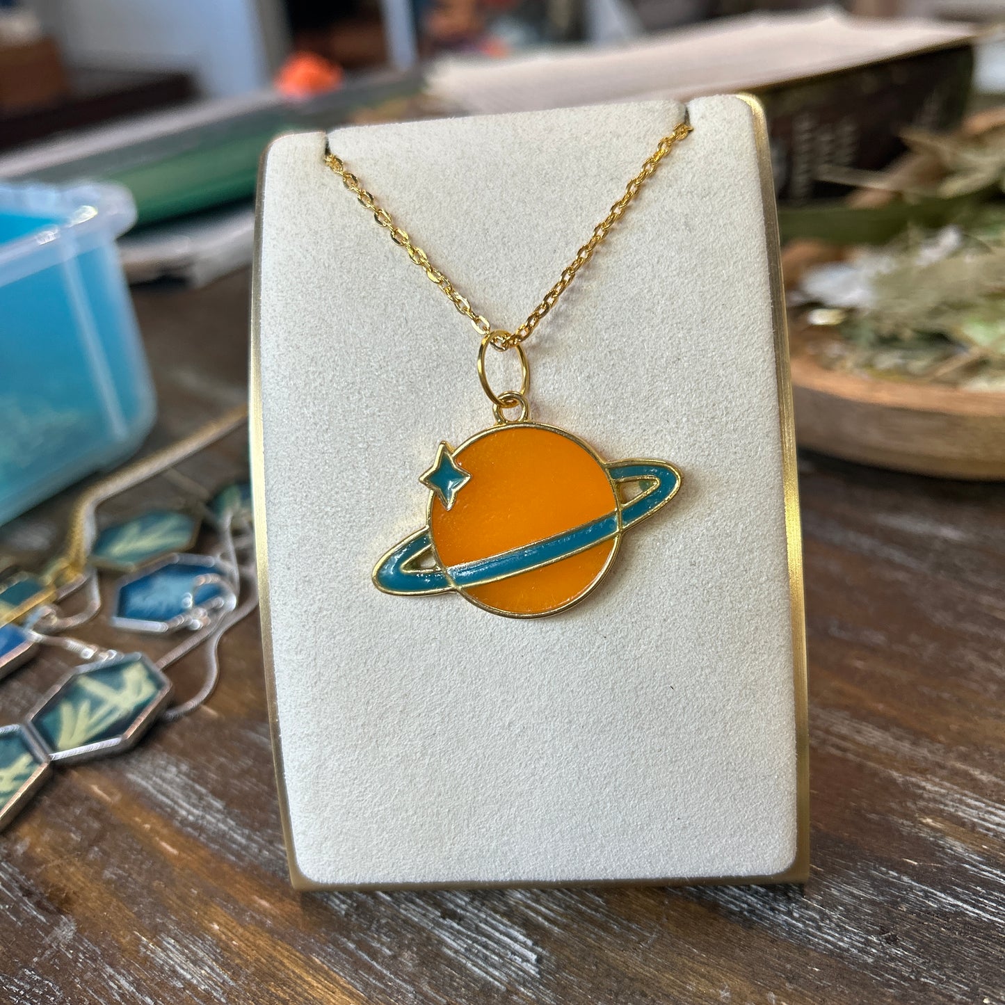 Ad Astra Saturn Necklace Orange