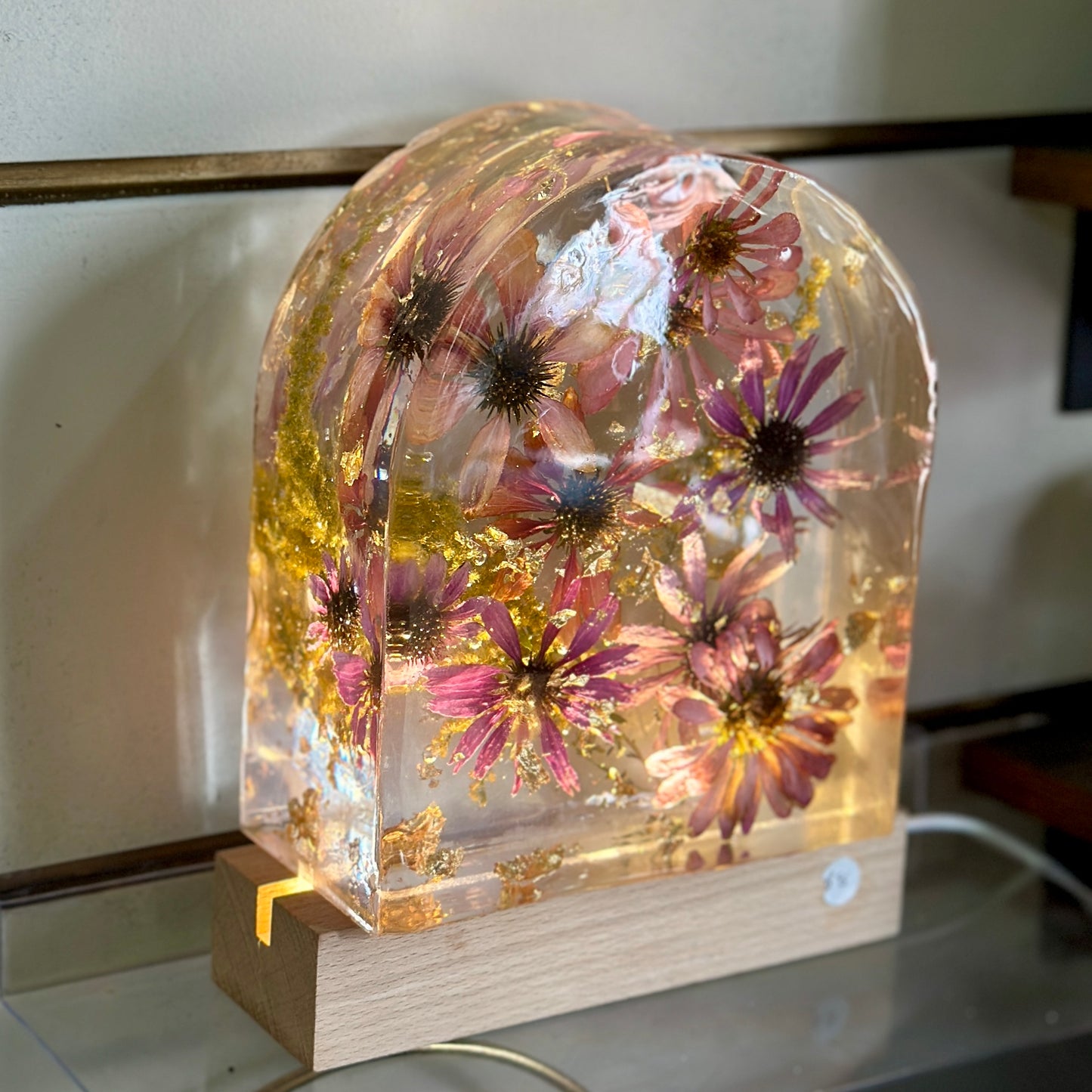 Zinnia and gold resin arch