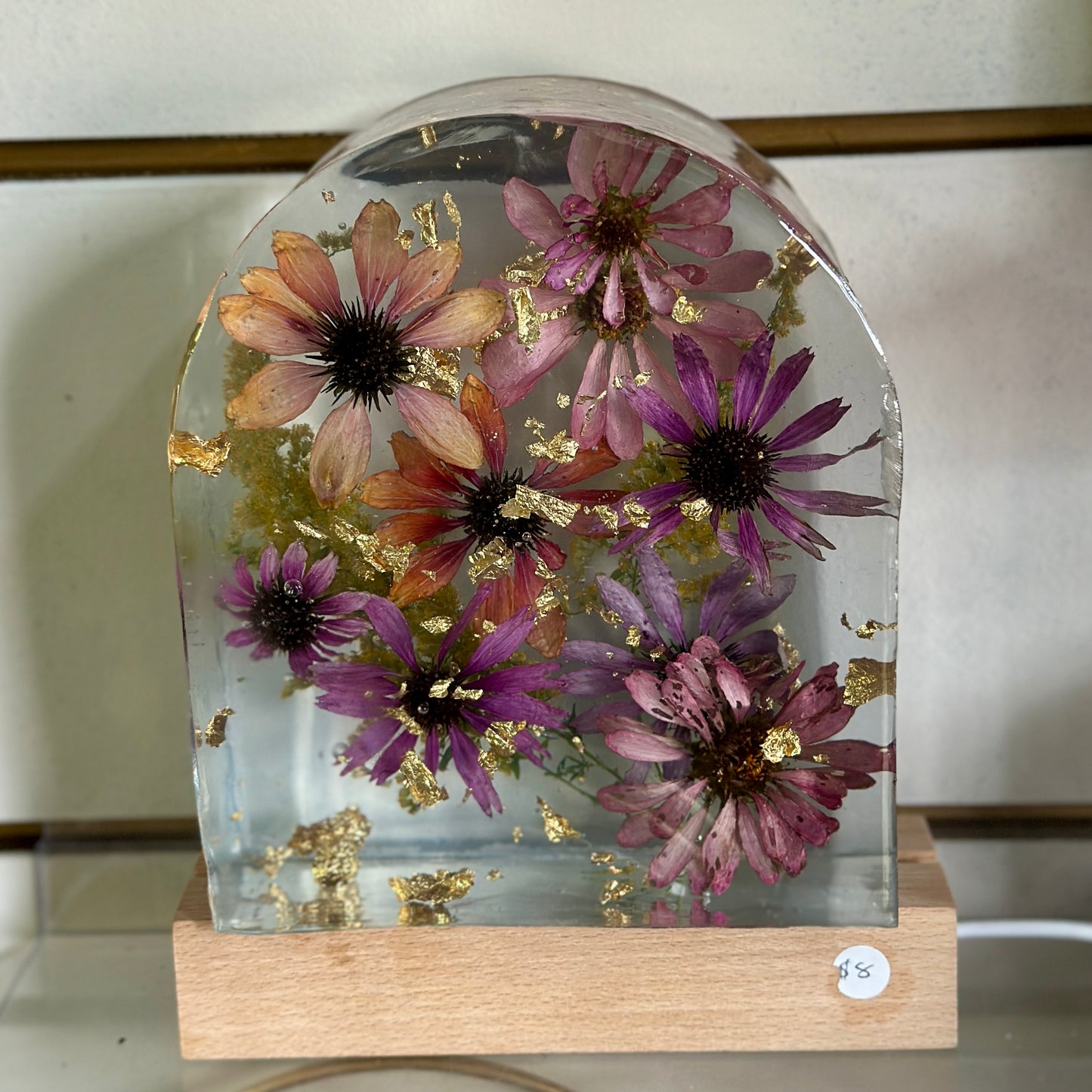 Zinnia and gold resin arch