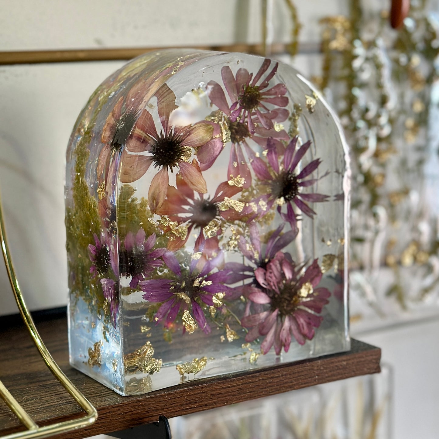 Zinnia and gold resin arch