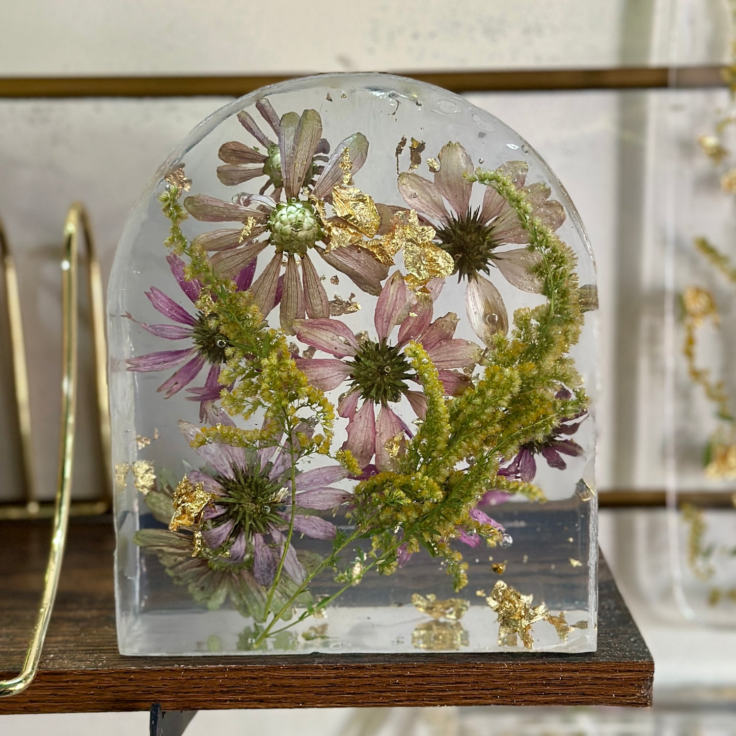 Zinnia and gold resin arch