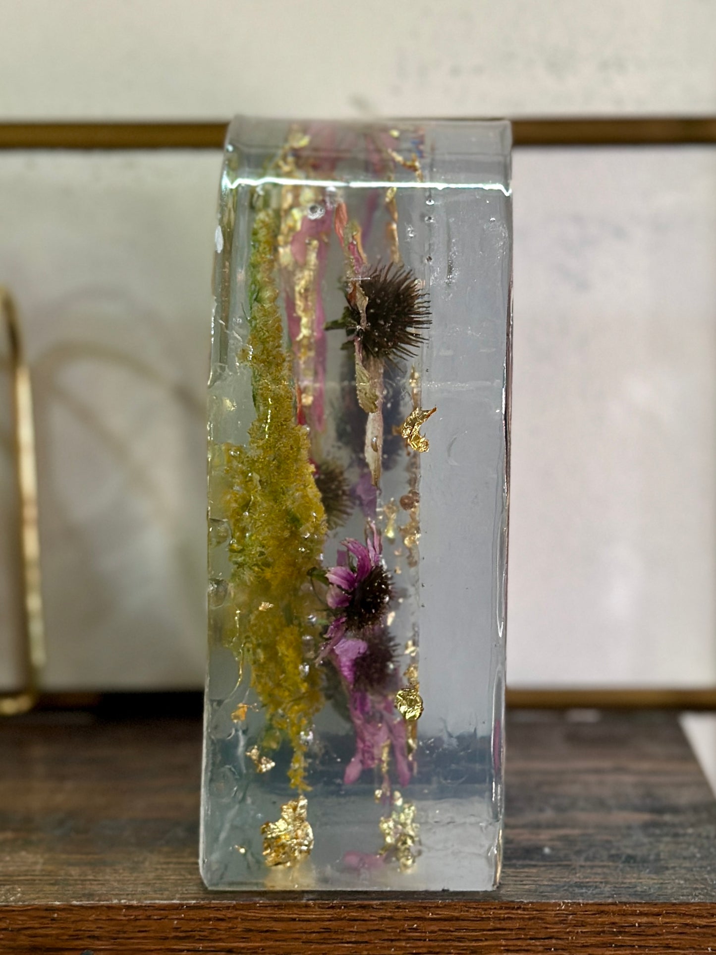 Zinnia and gold resin arch