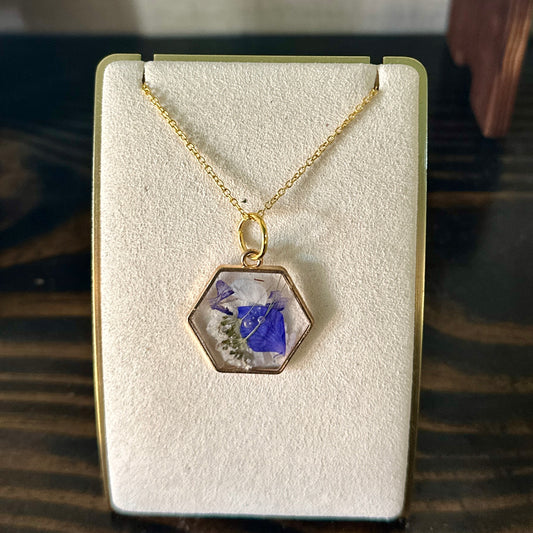 Geometric gold-framed botanical necklace (violet and white)