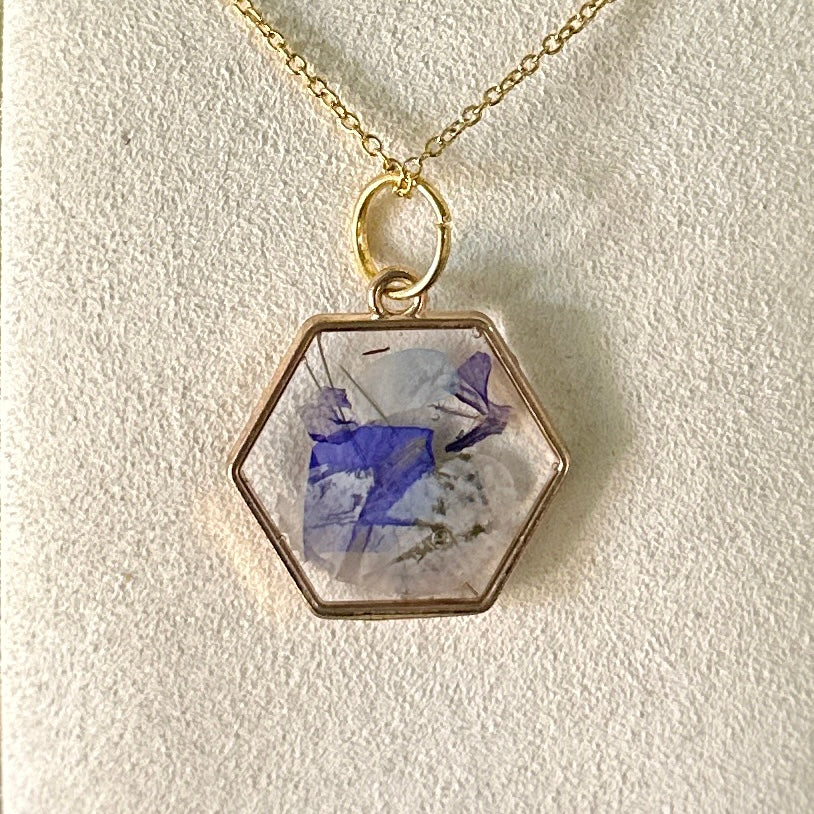 Geometric gold-framed botanical necklace (violet and white)