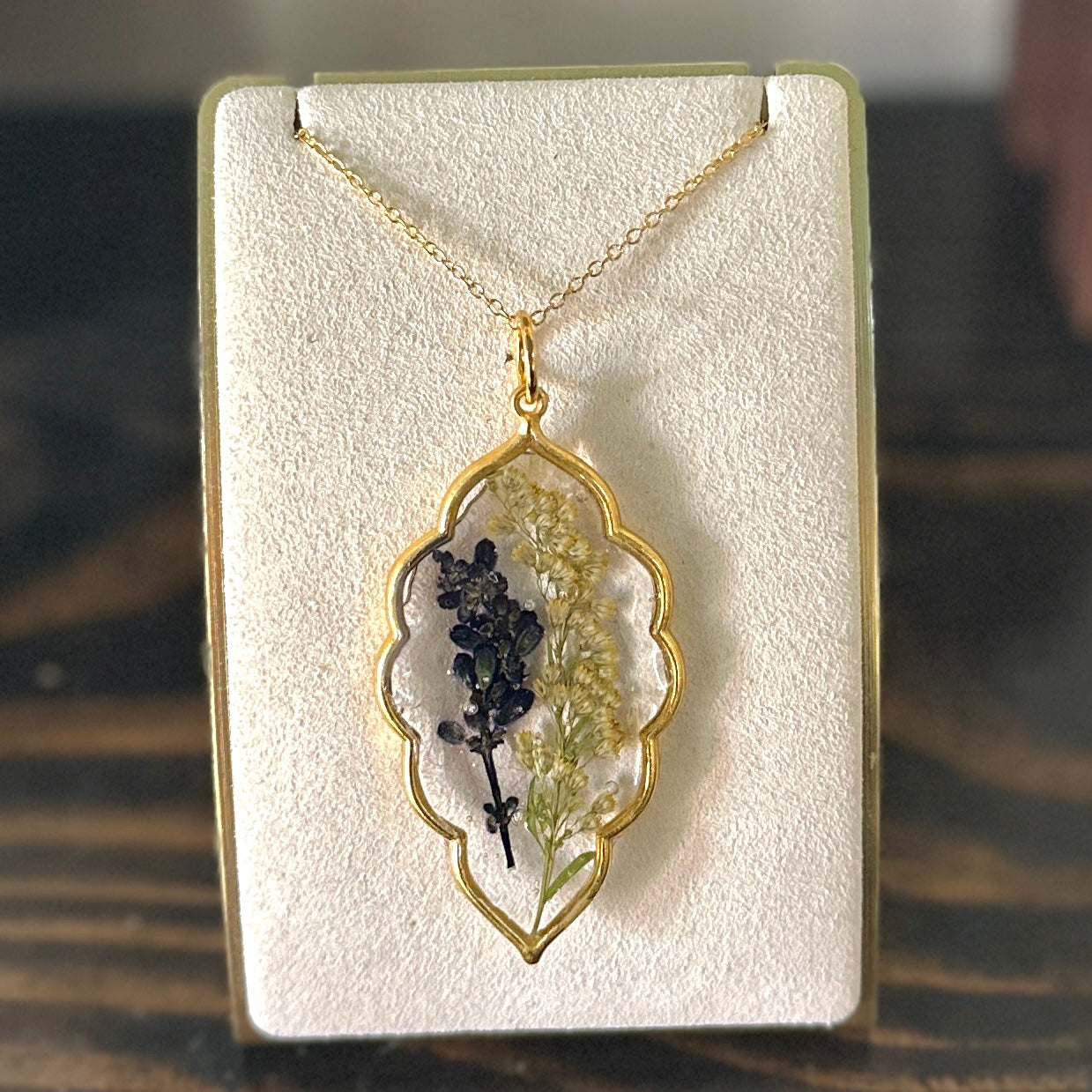 Gold-framed botanical necklace (deep purple and yellow)