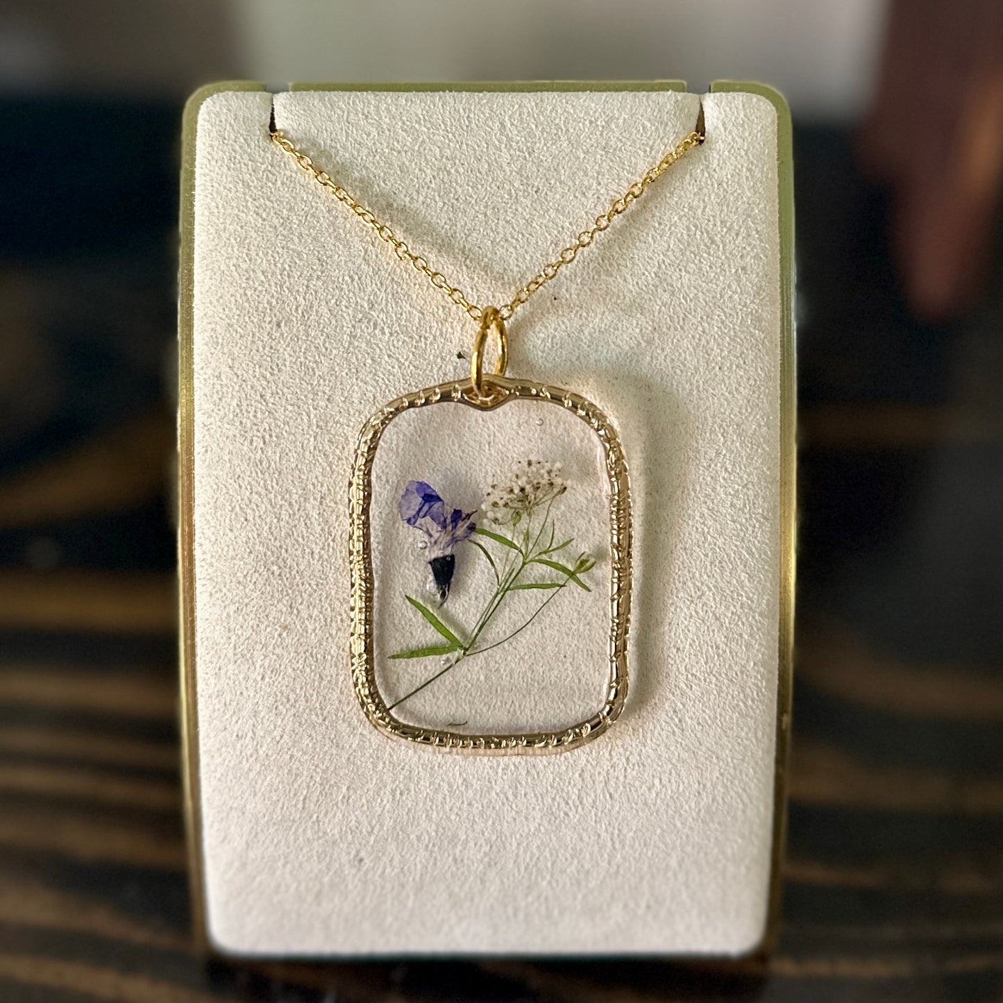 Gold-framed botanical necklace (violet, white, and green) 4