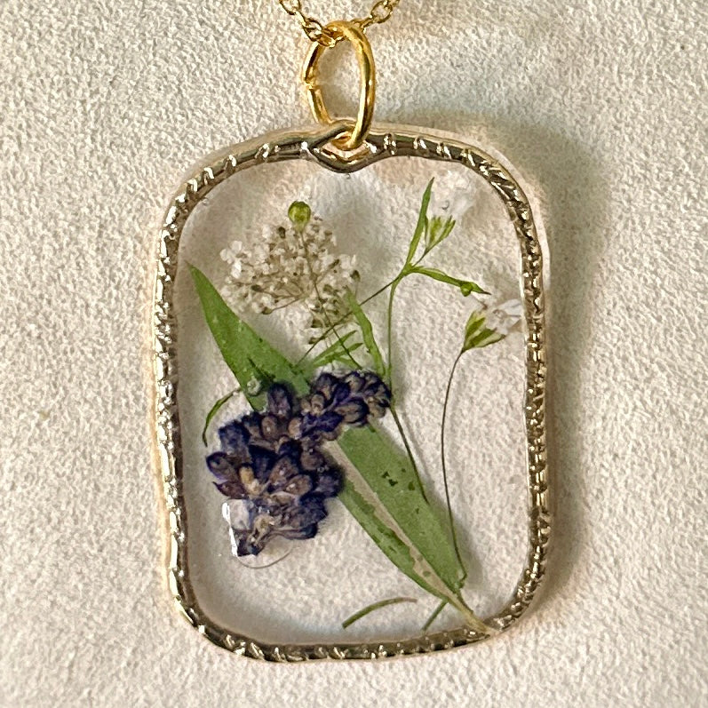 Gold-framed botanical necklace (violet, green, and white) 3