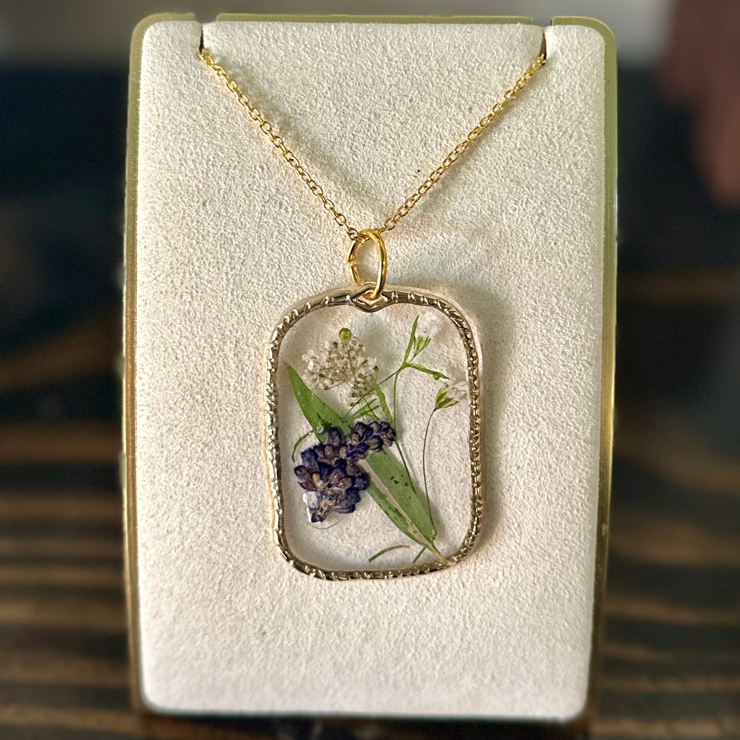Gold-framed botanical necklace (violet, green, and white) 3