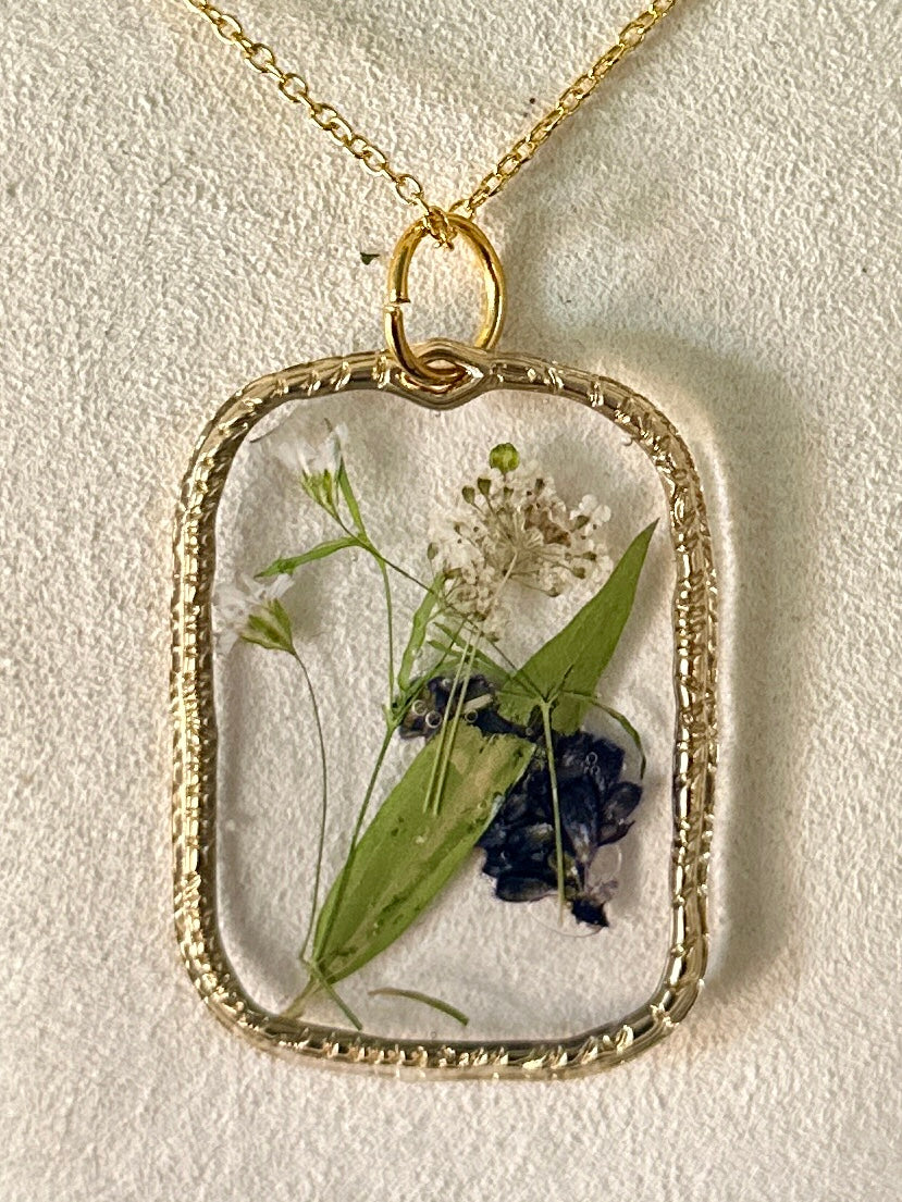 Gold-framed botanical necklace (violet, green, and white) 3