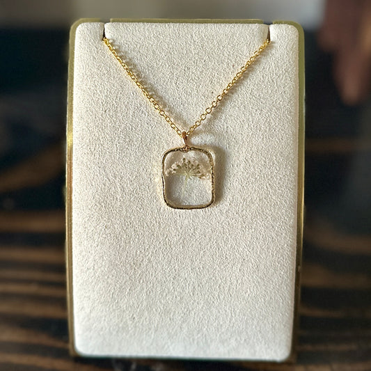 Gold-framed botanical necklace (small white flower)