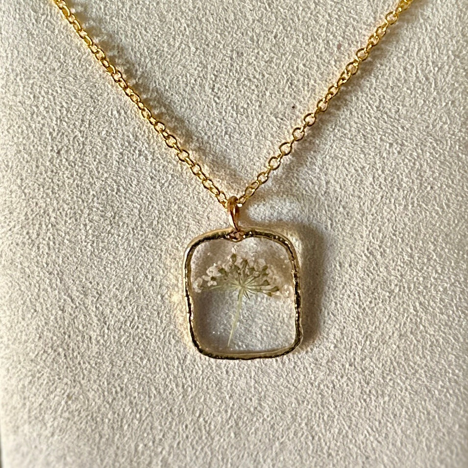 Gold-framed botanical necklace (small white flower)