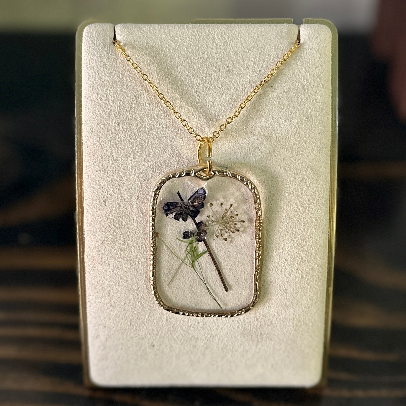 Gold-framed botanical necklace (violet, green, and white) 2