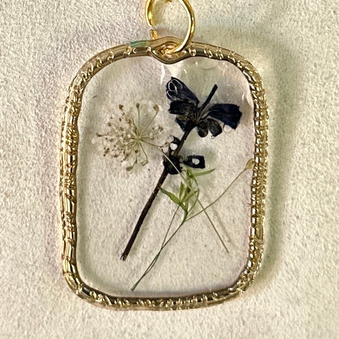 Gold-framed botanical necklace (violet, green, and white) 2