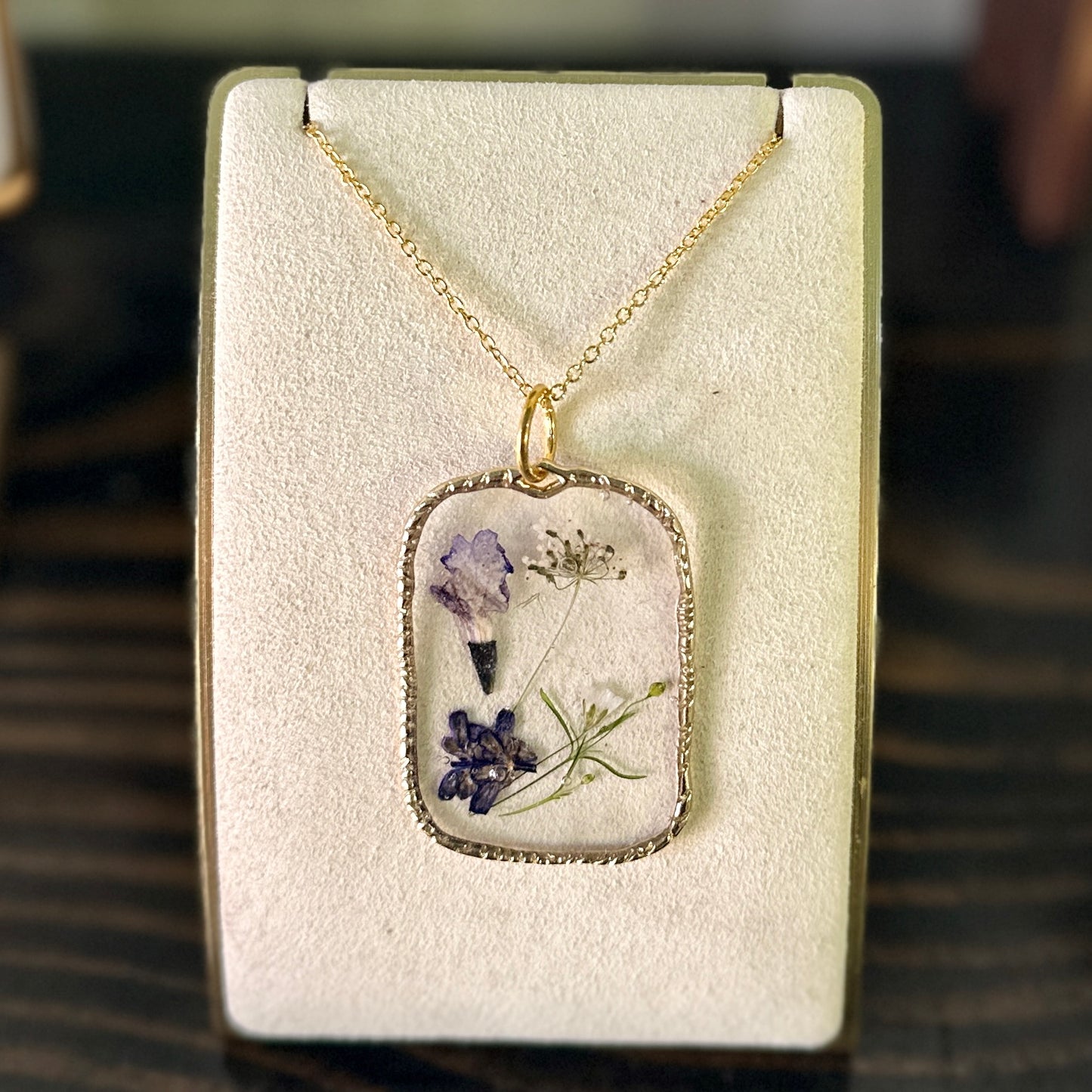 Gold-framed botanical necklace (violet and white) 1