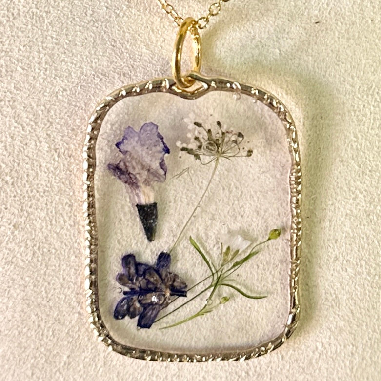 Gold-framed botanical necklace (violet and white) 1