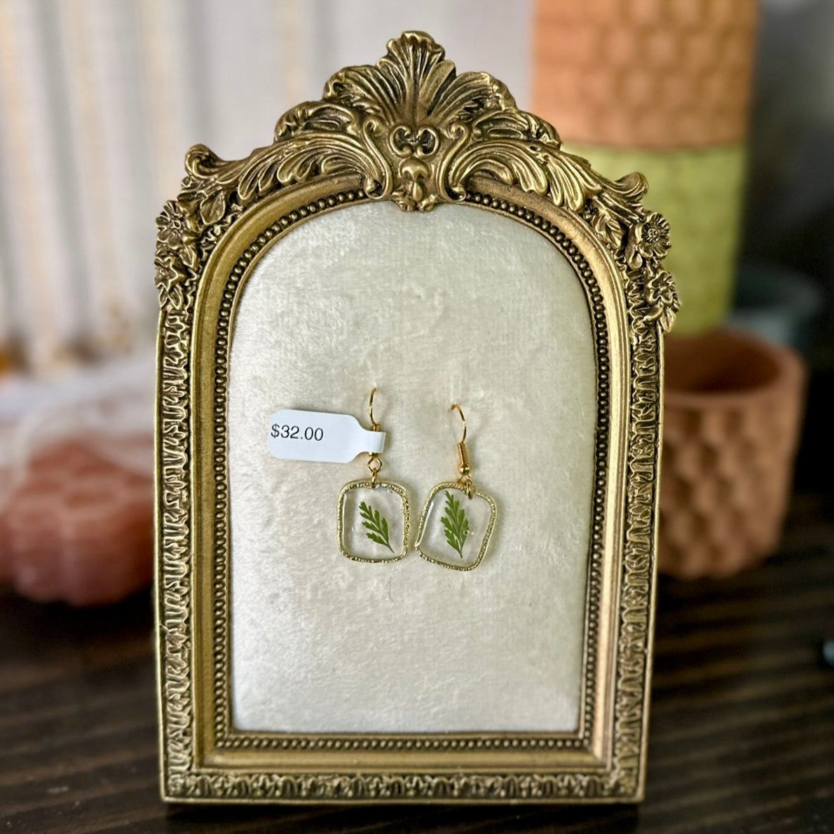 Gold-framed botanical earrings in green