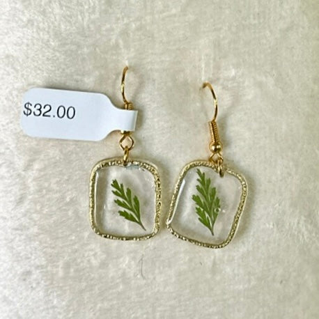 Gold-framed botanical earrings in green