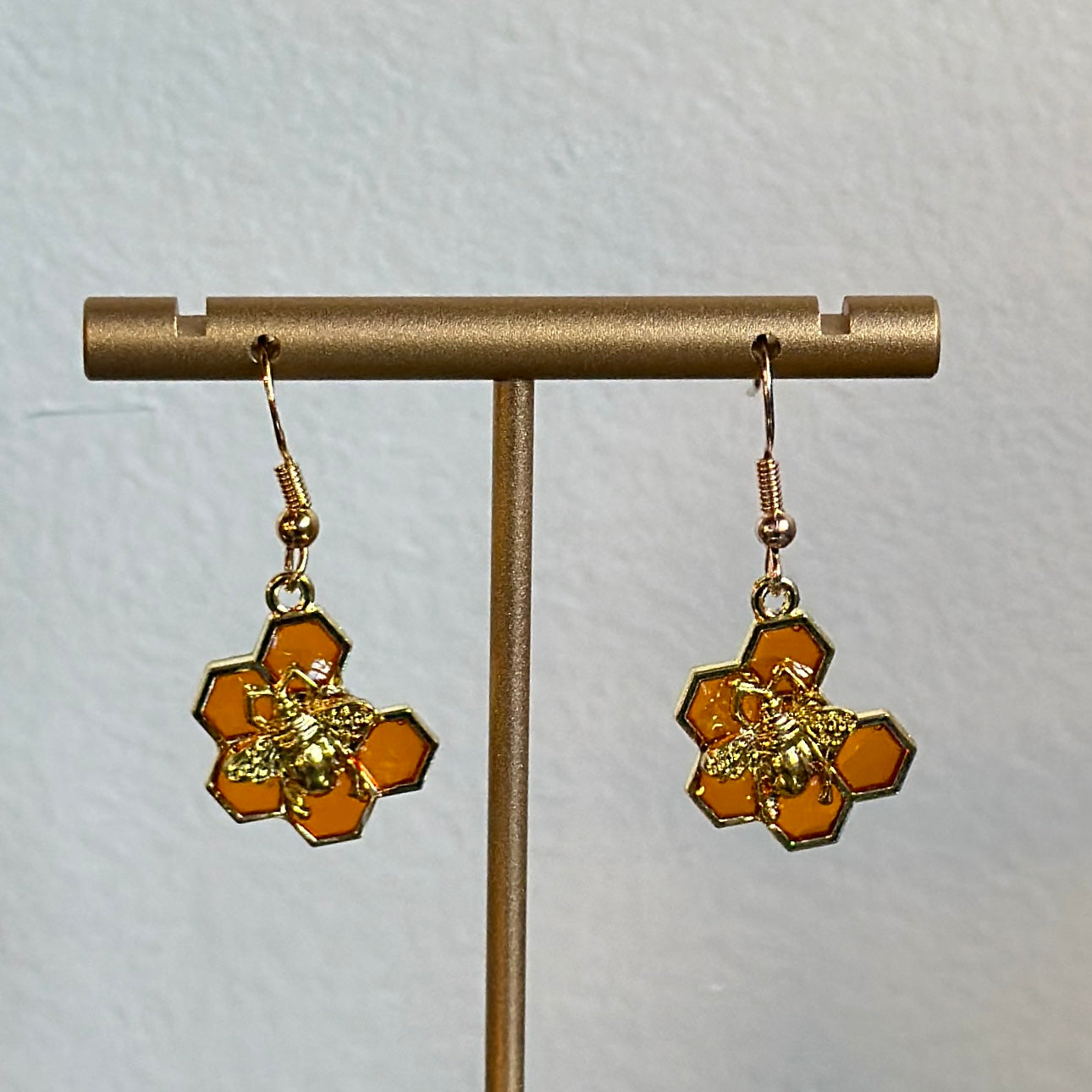 Orange honeycomb and bee earrings (7 hex)